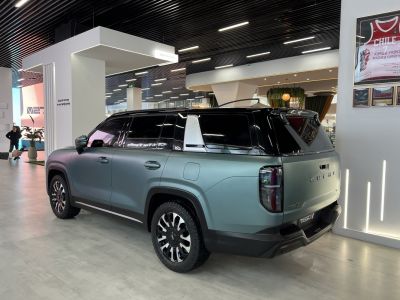 SUV rear and side view in matte finish with rugged wheels and tinted windows