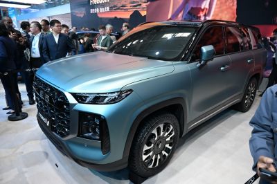 Matte finish SUV with large front grille and LED headlights