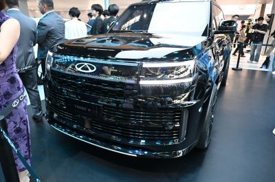 Sleek front grille with illuminated logo and distinctive LED headlights
