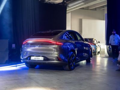 Sleek rear of car with continuous LED light strip and modern styling