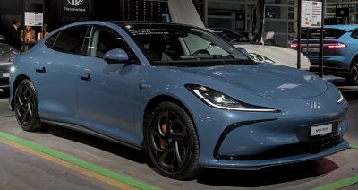 Sleek electric sedan with LED headlights and black alloy wheels