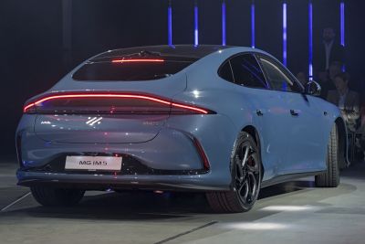 Sleek rear view with continuous LED tail lights and aerodynamic curves.