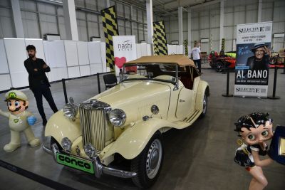 Retro beige convertible with soft top and classic chrome details
