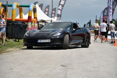 Front view of black sports coupe with angular headlights and aggressive grille