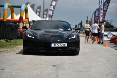 Front view of sports car with LED headlights and aerodynamic hood