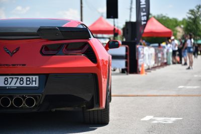 Rear angular tail lights and quad exhaust pipes on red sports coupe