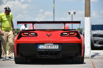 Rear view with distinctive taillights and large racing spoiler