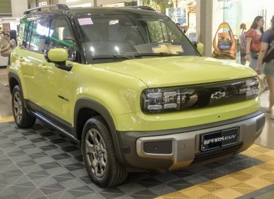 Front view of electric SUV with black accent grille and LED headlights