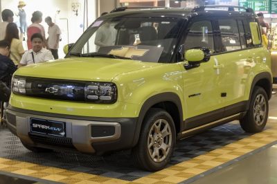 Electric SUV with LED headlights and two-tone black and yellow body
