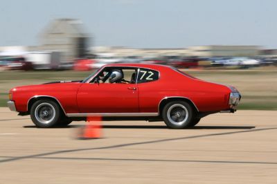 Red muscle sport coupe racing on track