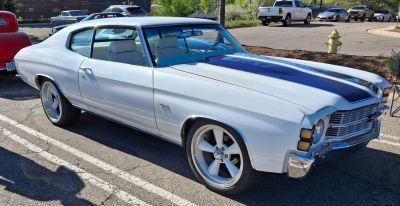 Muscle car with SS badge and racing stripes