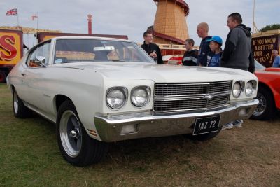Classic dual round headlights and wide chrome grille front end.