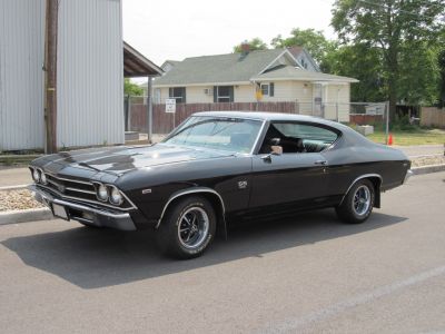 Black 1969 muscle coupe with SS 396 badge and classic styling