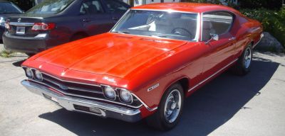 Classic muscle car front with chrome bumper and dual headlights