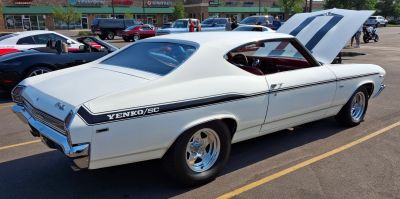 Classic 1969 muscle coupe with distinctive Yenko/SC stripes and polished wheels