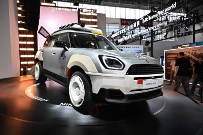 Futuristic off-road SUV with rugged body cladding and roof rack