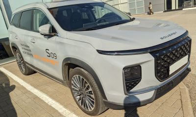 Modern SUV front grille and LED headlights with chrome accents