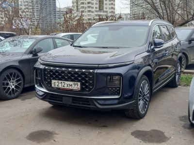 Diamond pattern grille and LED headlights on SUV front.