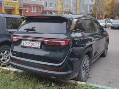 Rear view of SUV with sleek LED taillights and rear spoiler