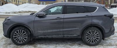 Modern SUV with alloy wheels and tinted windows, side view