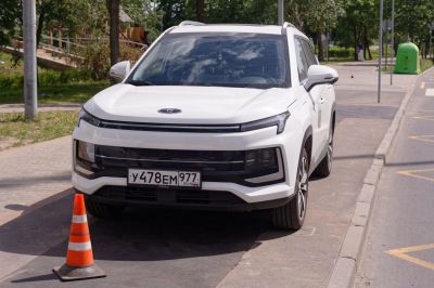 Front view of an SUV with LED headlights and a sleek grille design.