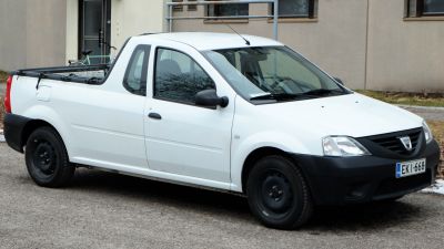 White single cab pick-up truck with open cargo bed and black front trim