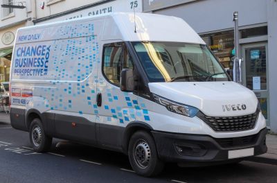 Front and side view of a modern panel van with updated headlights and grille