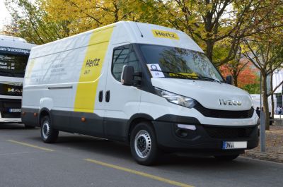 White panel van with Hertz branding and long wheelbase