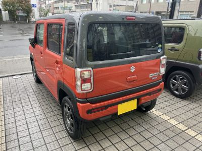 Rear view of a compact boxy SUV with two-tone colors.