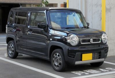 Compact SUV front side view with round headlights and bold grille