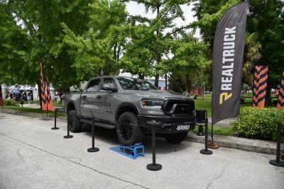 Gray gray 4x4 off-road pickup with rugged tires and bold front design