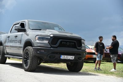 Front view of a Ram pickup with bold grille and rugged offroad tires