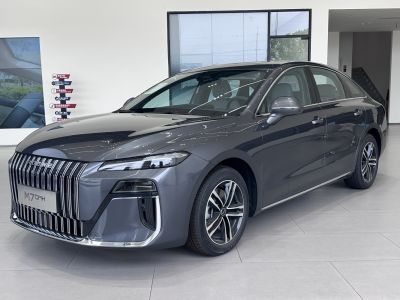 Sleek sedan front with vertical grille and LED headlights