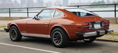 Fastback coupe rear design with distinctive taillights and chrome bumper