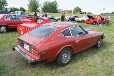 Rear and side view of 1970s vintage sports coupe with distinctive wheels.