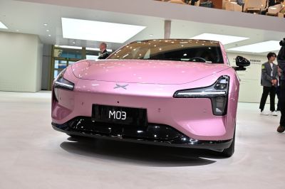 Front view of a sleek car with distinctive LED headlights and smooth aerodynamic design