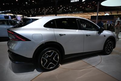 Side and rear profile of modern electric SUV with distinctive LED taillights.
