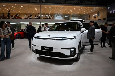 Front view of electric SUV with horizontal LED headlights and aerodynamic bumper