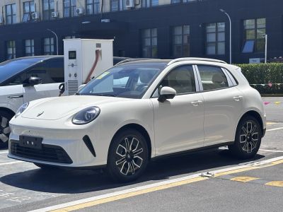Electric hatchback with round headlights and modern alloy wheels