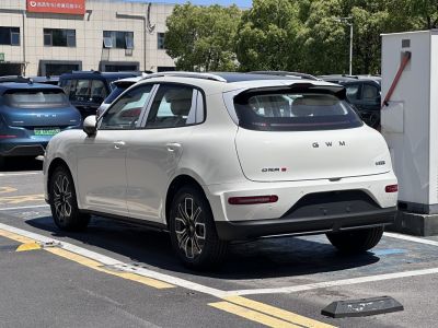 Rear view of a white hatchback with alloy wheels and aerodynamic styling