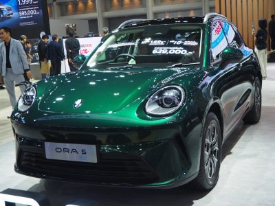 Sleek front view with distinct round LED headlights and aerodynamic curves