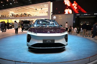 Front view of an electric sedan with advanced LED lighting