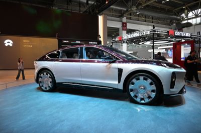 Sleek electric sedan side profile with aerodynamic design and futuristic wheels