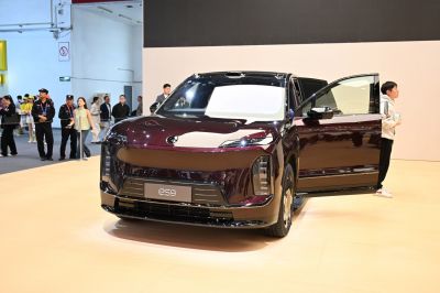 Futuristic electric SUV front with open door