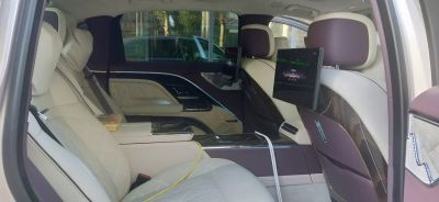 Luxury rear seats with entertainment screens and plush leather upholstery