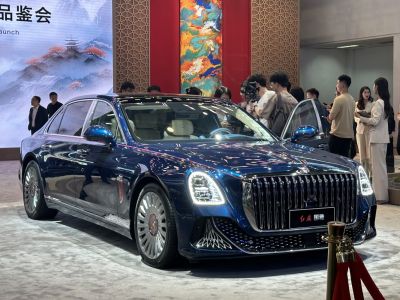 Luxury sedan with prominent chrome grille and LED headlights