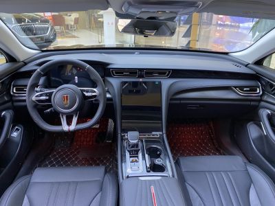 Digital dashboard and touchscreen console with black leather seating and ambient lighting