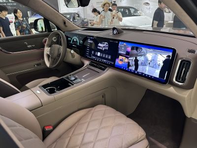 Digital dashboard with multi-screen infotainment and quilted leather seating