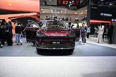 Front view of SUV with open doors and modern headlights