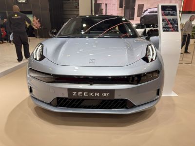 Front view with sleek hood and distinctive LED headlights